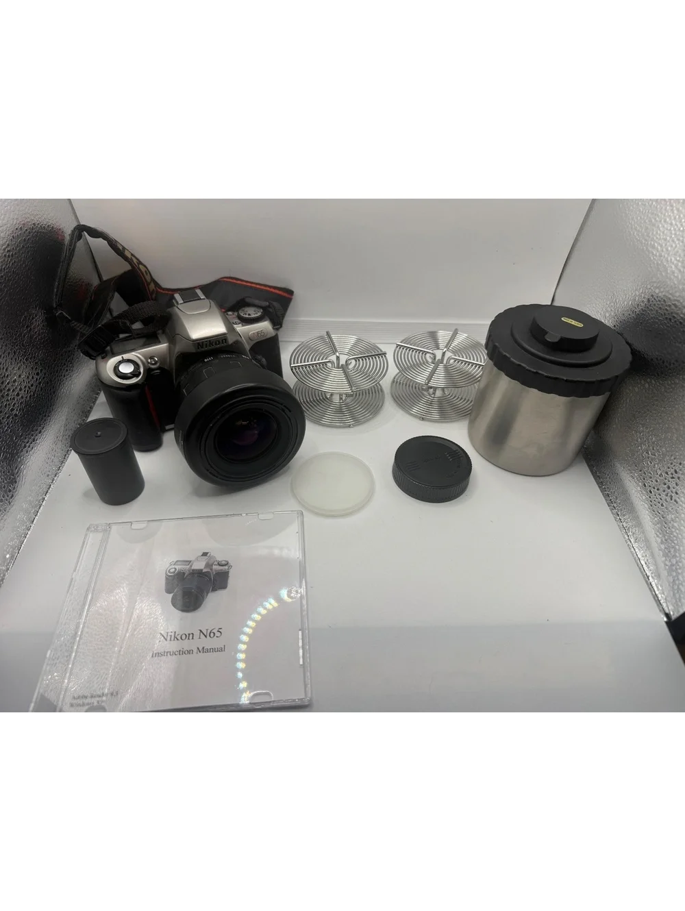 Nikon N65 35-70mm SLR Film Camera with Accessories and Carrying Case